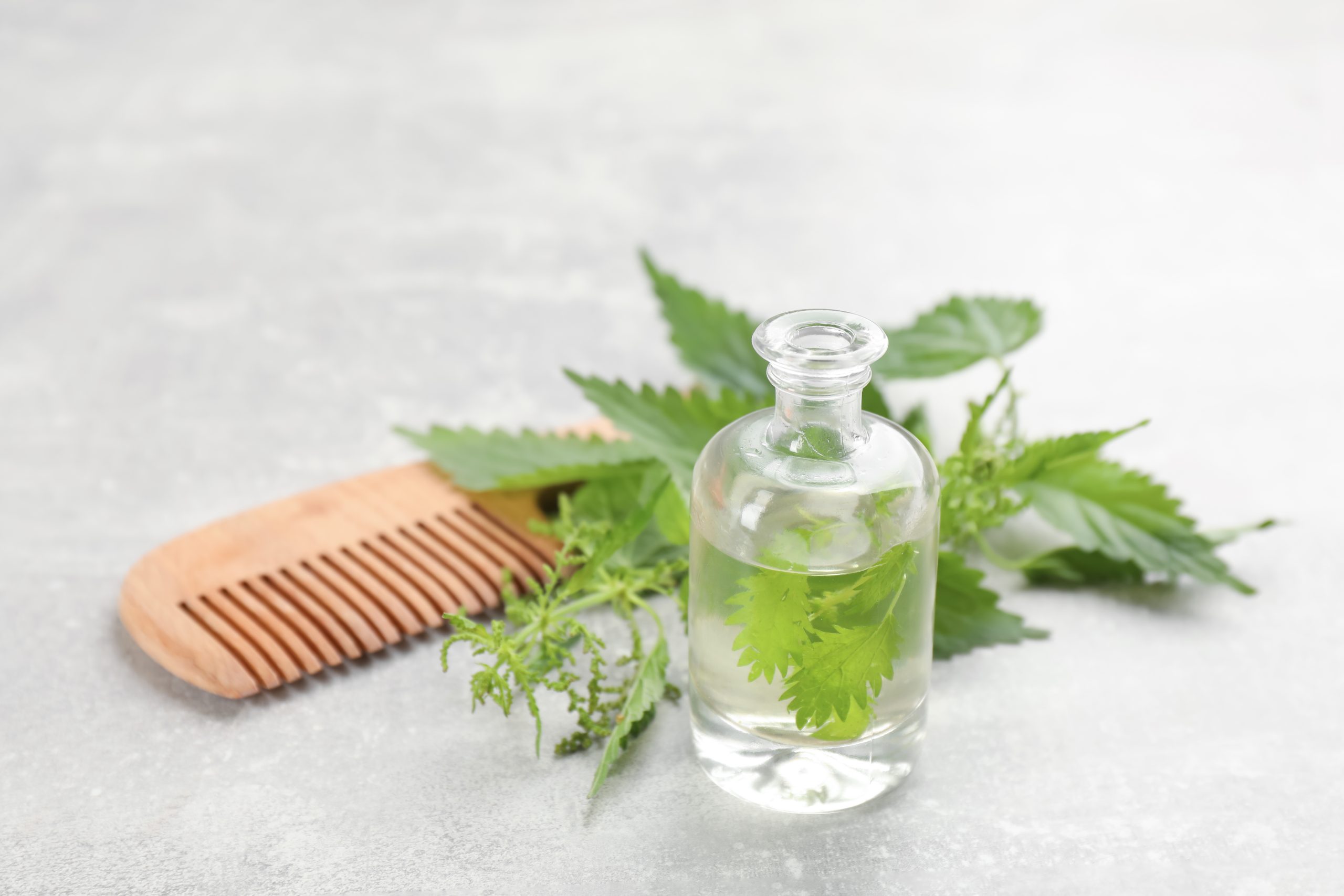Herbal Oil for Haircare with Comb and Greens